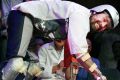 Thomas Thwaites, left, accepts the Ig Nobel prize in biology from Nobel laureate Eric Maskin while wearing his goat ...