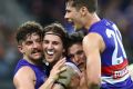 The Bulldogs celebrate victory in the preliminary final.