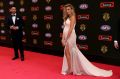 Geelong footballer Jimmy Bartel poses with his wife Nadia Bartel on the red carpet ahead of the 2015 AFL Brownlow Medal ...