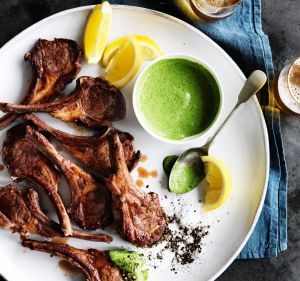 Lamb cutlets with green yoghurt sauce.