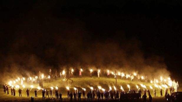 Members of the Ku Klux Klan participate in cross burnings after a "White Pride" rally in April.