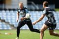 Old bull on the charge: Luke Lewis takes a pass during a Sharks training session at Southern Cross Group Stadium.