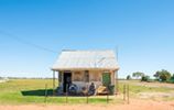 "Retired Cattle Drover Kevin Oates is known by locals in the town to be a legend who lives in a small house iconic to the small town and the house was once the Windorah Court House before being relocated from behind the Police Station. Photo: Bradley Kanaris"