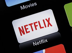 This June 24, 2015 photo shows the Netflix Apple TV app icon, in South Orange, N.J. Netflix, a vocal opponent of Comcast's failed bid for Time Warner Cable, on Wednesday, July 15, 2015 said it supports Charter Communications' bid to do the same in a deal that would create another cable giant.