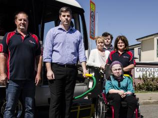 Parents have concerns over changes to school transport assistance for students with a disability under the NDIS. Left to right: Rob Stevens (Ace Buses), Mark Ryan MP, Louise Catton, Oliver Catton, Jane Stevens (Ace Buses), and (front row) Daria Ward