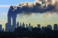 Smoke billows from the twin towers of the World Trade Center in New York after airplanes crashed into both towers on ...