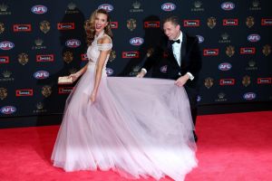 Joel Selwood of the Geelong Cats and Brit Davis pose on the red carpet ahead of the 2016 AFL Brownlow Medal count at ...