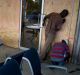 Workers set up a board as protection against hurricane Matthew in an hotel in Kingston, Jamaica.