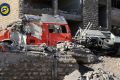 Destroyed ambulances are seen outside the Syrian Civil Defence main center after airstrikes in Ansari neighborhood in ...
