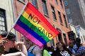 A woman holds a rainbow flag during a Pride Parade in New York. Young Americans overwhelmingly say they support LGBTI ...