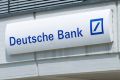 Customers enter a Deutsche Bank branch in Boblingen, Germany.