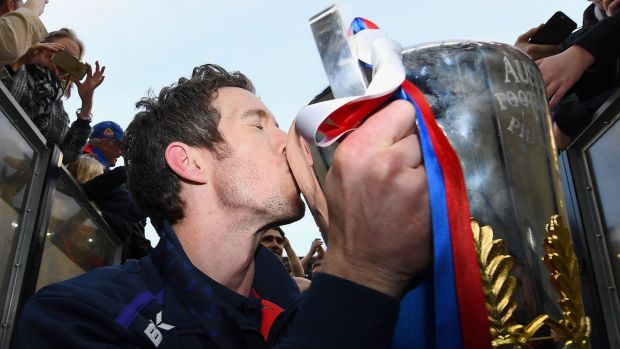 Injured Footscray skipper Bob Murphy  kisses the Premiership Cup after the Bulldogs' win over the Sydney Swans.