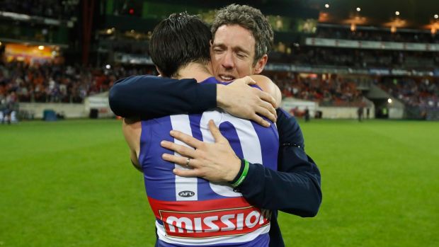 Full of heart: Injured Bulldogs skipper Bob Murphy embraces his stand-in, Easton Wood, after the Bulldogs beat GWS.