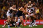 Matt Priddis fires off a handpass during the first quarter against Hawthorn at Domain Stadium.