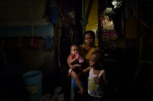 Ruth-Jane Sombrio whose husband was shot dead at home, with her daughter Rogielyn and son Rogie Sebastian.