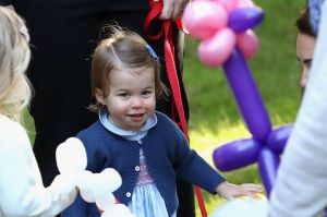 Princess Charlotte plays with a dog named Moose.