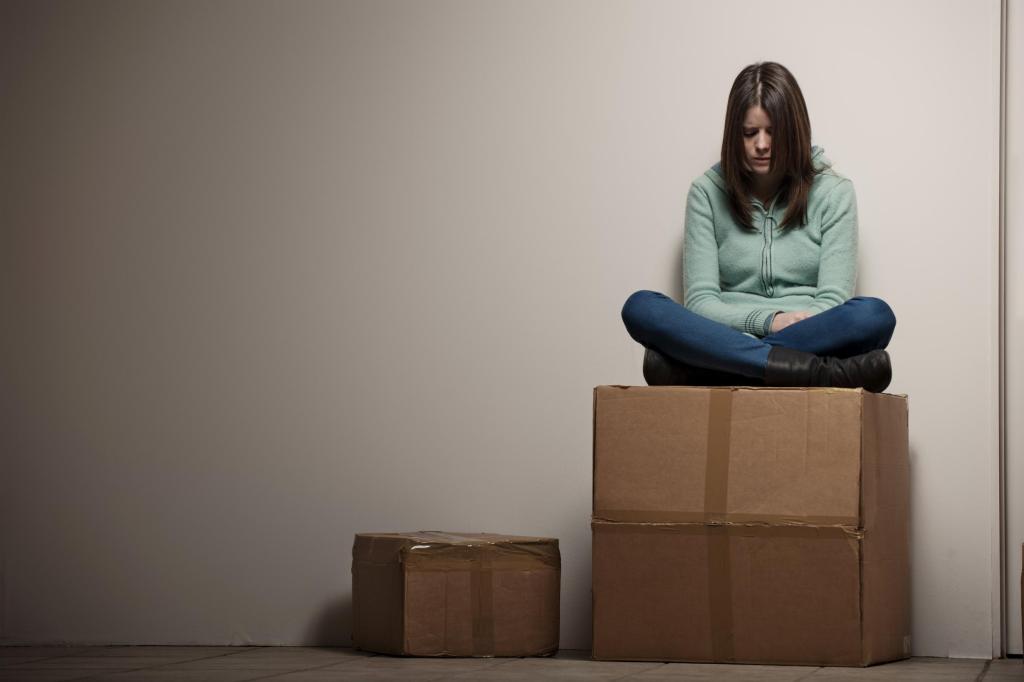 Teenage girl sitting on cardboard box