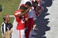 Protest: Kansas City Chief's cornerback Marcus Peters raises his fist as the US national anthem is played.