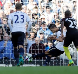 Tottenham Hotspur?s Erik Lamela, second right shoots at goal during the Premier League soccer match between Tottenham ...