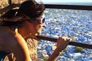 Woman overlooking Jodhpur from Meherangarh Fort.  India