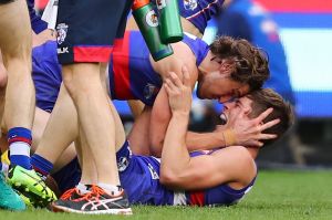 Marcus Bontempelli of the Bulldogs celebrates at the final siren during the 2016 Toyota AFL Grand Final match between ...