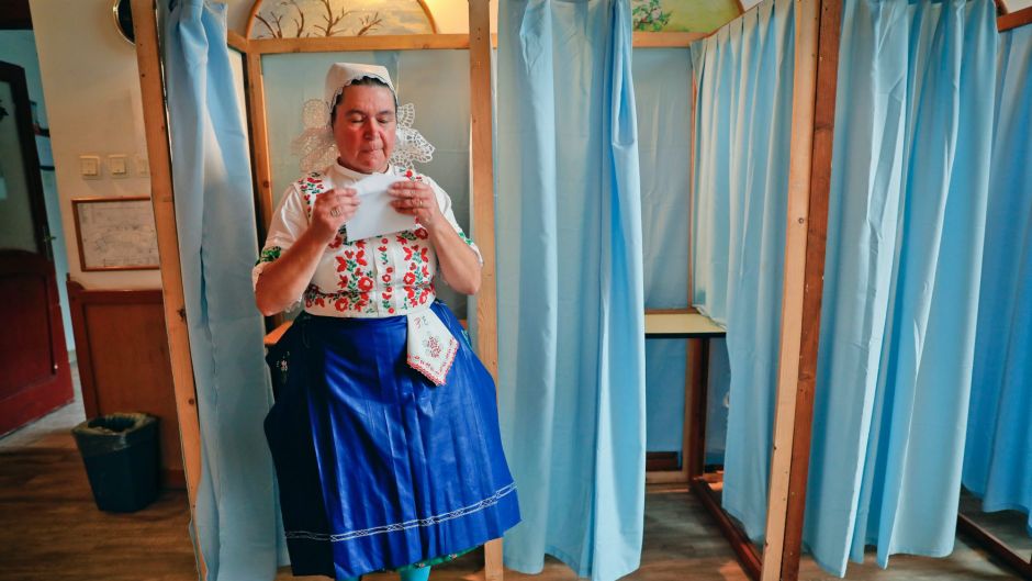 Edit Piros, an ethnic Hungarian from Transylvania, central Romania, exits a voting cabin after voting in the referendum ...