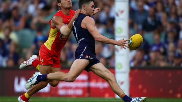 Hayden Ballantyne of the Dockers kicks for goal.