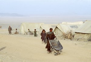 File - Afghan residents of the Roghani Refugee Camp in Chaman, a Pakistani border town.