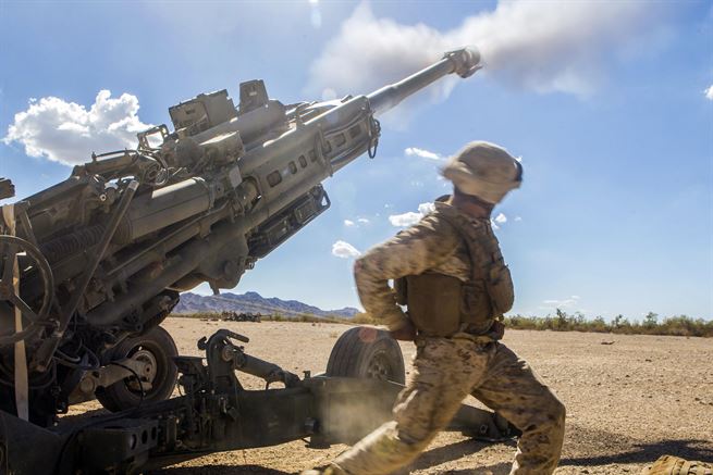 Marine Corps Cpl. Eduardo Osorionunez fires an M777 howitzer during a battle drill at Fire Base Burt, Calif., Oct. 1, 2016. Marine Aviation Weapons and Tactics Squadron 1 hosted the drill as part of a seven-week training event. Marine Corps photo by Cpl. Abraham Lopez