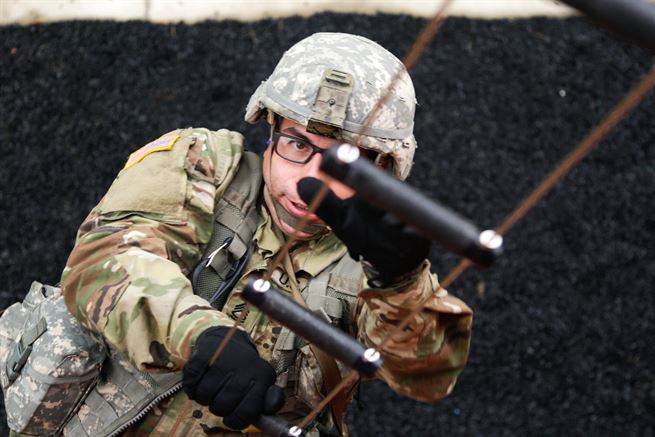 Army Sgt. 1st. Class Alexander Garcia climbs a ladder as he participates in the tower event during the Army 2016 Best Warrior Competition at Fort A.P. Hill, Va., Sept. 27, 2016. Garcia is assigned to Army Material Command. Army Photo by Pfc. Fransico Isreal