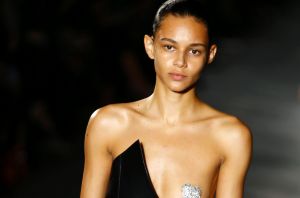 A model wears a single silver, sparkling pastie in the Saint Laurent show.