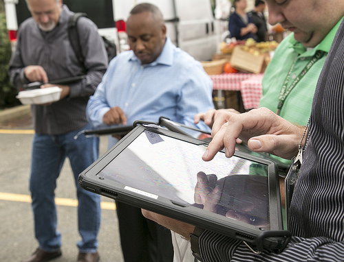 Visitors at USDA's Farmers Market on iPads