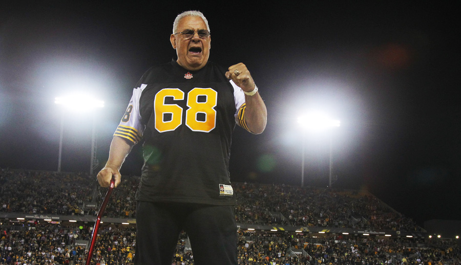 Angelo Mosca reacts to the cheering crowd, during a half-time CFL ceremony in Hamilton on Thursday, Aug. 27, 2015. The Tiger-Cats are retired the former great's jersey #68. (CFL PHOTO - Dave Chidley )