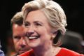 Democratic presidential nominee Hillary Clinton walks off the stage with her husband Bill after the first debate.