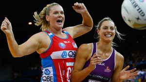 BRISBANE, AUSTRALIA - JULY 31:  Caitlin Thwaites of the swifts competes for the ball with Laura Geitz of the firebirds ...