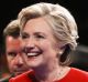 Democratic presidential nominee Hillary Clinton walks off the stage with her husband Bill after the first debate.