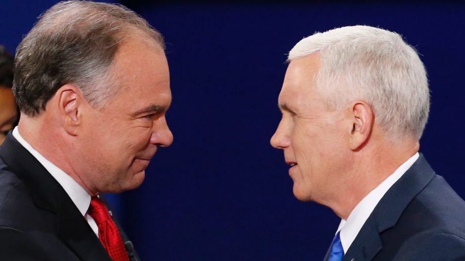 Republican vice-presidential nominee Indiana Governor Mike Pence, right, shakes hands with Democratic vice-presidential ...