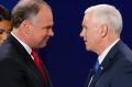 Republican vice-presidential nominee Indiana Governor Mike Pence, right, shakes hands with Democratic vice-presidential ...