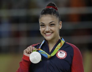 United States' Laurie Hernandez displays her silver medal for the balance beam during the artistic gymnastics women's apparatus final at the 2016 Summer Olympics in Rio de Janeiro, Brazil, Monday, Aug. 15, 2016.