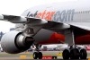 A Jetstar plane on the runway at Sydney Airport.