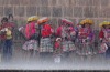 A sudden rain storm in Cusco Peru meant that everyone had to run for cover. I spotted these gorgeous women sheltering at ...