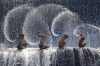 Boys playing in the Udam Dam River in Bali.