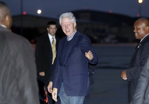 Former President Bill Clinton walks across the tarmac as he arrives with President Barack Obama on Air Force One, Friday, Sept. 30, 2016, in Andrews Air Force Base, Md., as they return from attending the funeral of former Israeli President Shimon Peres in Jerusalem.