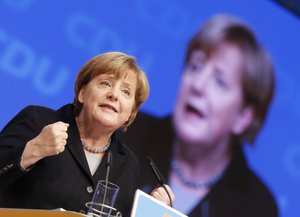 German Chancellor Angela Merkel speaks during a party convention of the Christian Democrats (CDU) in Karlsruhe, Germany, Monday, Dec. 14, 2015.