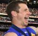 Dale Morris and Tom Boyd of the Bulldogs celebrate with the trophy.