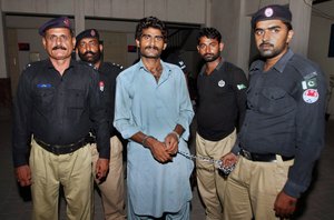 Pakistani police officers present Waseem Azeem, the brother of slain model Qandeel Baloch, before the media following his arrest at a police station in Multan, Pakistan, Sunday, July 17, 2016.