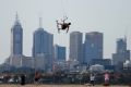 A kite border takes advantage of strong winds at Brighton Beach on Thursday.