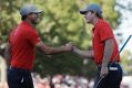 Whitewash: Brandt Snedeker and Brooks Koepka celebrate a birdie on the eighth hole for the US team.