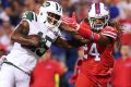 Tweet success: Brandon Marshall of the Jets is tackled by Stephon Gilmore.