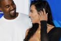 FILE - In this Aug. 28, 2016 file photo, Kanye West, left, and Kim Kardashian West arrive at the MTV Video Music Awards ...